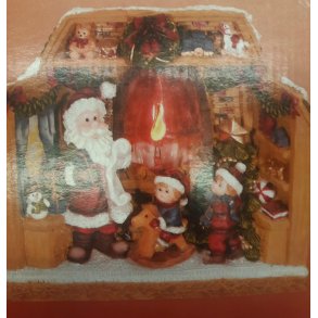 julemand stende ved kaminen og 2 brn