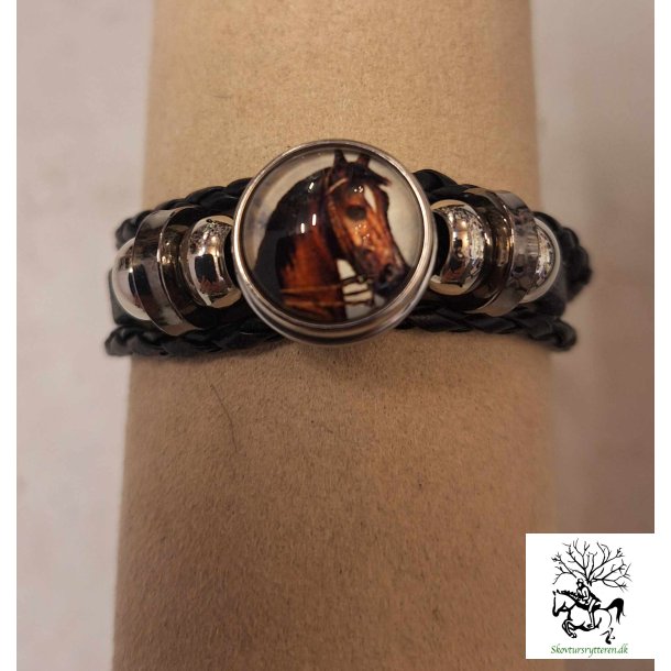 Armbnd i sort lderflet med hest emblem